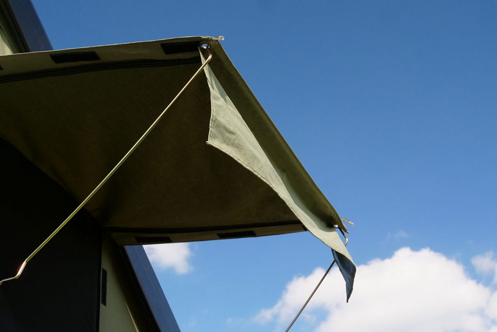 The awnings proved shelter from rain and sun.