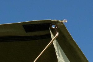 The awnings are connected with a hook and a ring on one end.