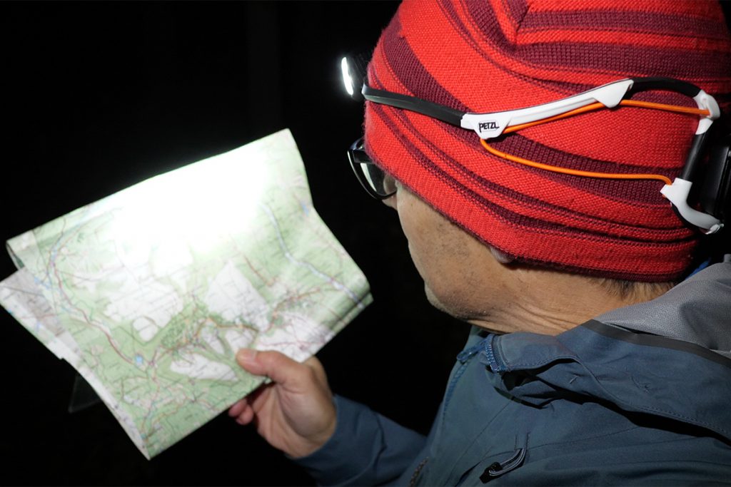 The white light of the Petzl Iko Core is not ideal for reading a map.