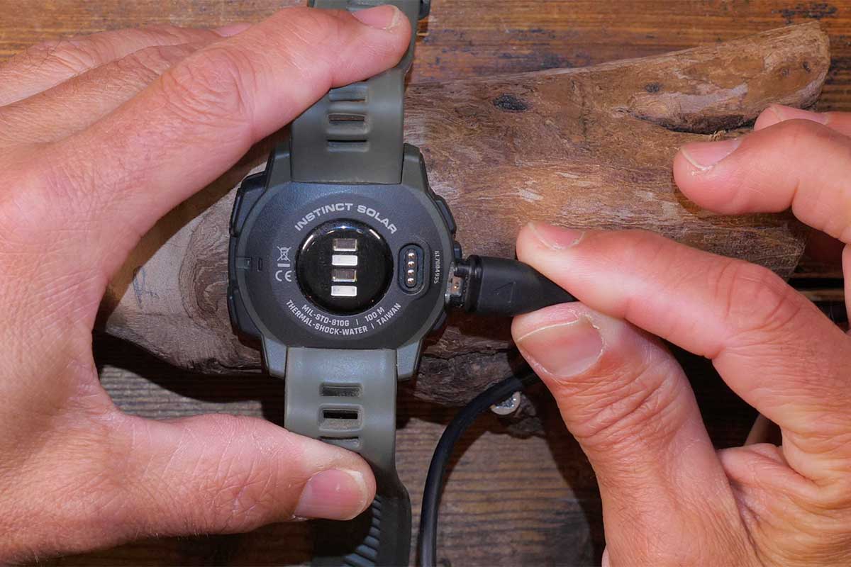 Charging can be done with a USB-cable that connects to the back of the watch case.