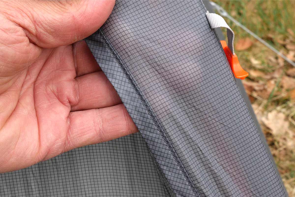 The fly is made of a ripstop polyester with a solution-dyed ripstop grid.